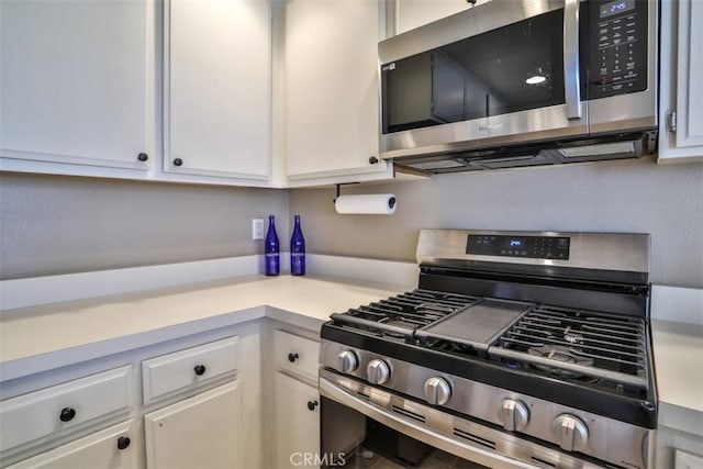 111 Greenfield, Irvine, CA 92614 - kitchen featuring appliances with stainless steel finishes, light countertops, and white cabinets