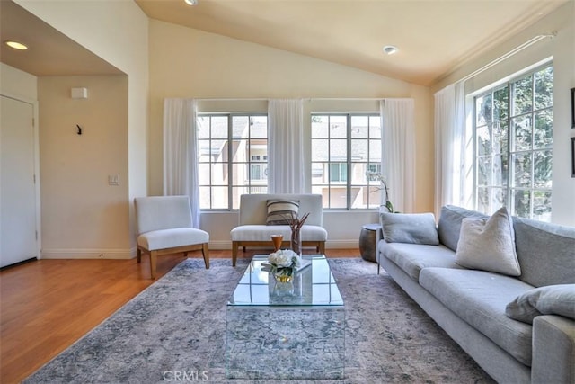 111 Greenfield, Irvine, CA 92614 - living area featuring vaulted ceiling, wood finished floors, baseboards, and recessed lighting