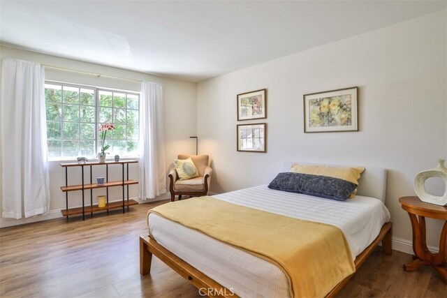 111 Greenfield, Irvine, CA 92614 - bedroom with wood finished floors and baseboards
