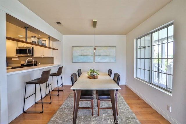 111 Greenfield, Irvine, CA 92614 - dining space featuring light wood-type flooring and baseboards