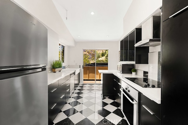 5140 Twilight Canyon Rd Unit 27H, Yorba Linda, CA 92887 - kitchen featuring black appliances, dark cabinetry, wall chimney exhaust hood, light countertops, and modern cabinets
