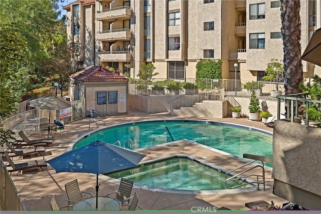 4141 Via Marisol Unit 215, Los Angeles, CA 90042 - community pool with a hot tub, fence, and a patio