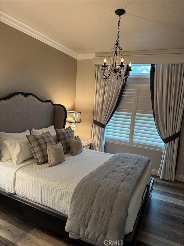 28185 Via Luis, Laguna Niguel, CA 92677 - bedroom with a chandelier, crown molding, dark wood-style floors, and baseboards