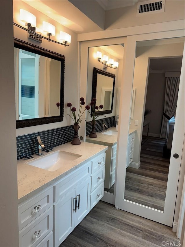 28185 Via Luis, Laguna Niguel, CA 92677 - bathroom featuring tasteful backsplash, wood finished floors, and vanity