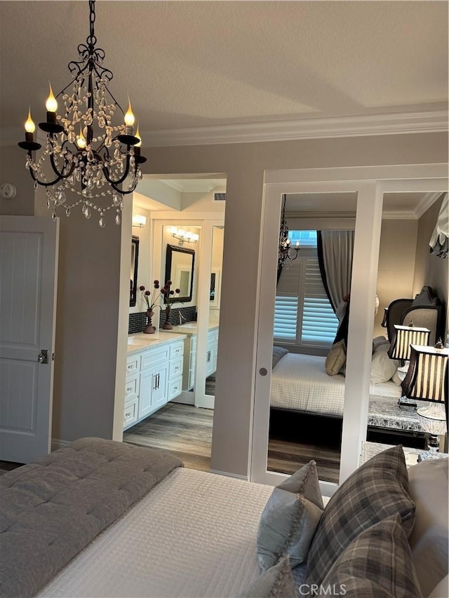 28185 Via Luis, Laguna Niguel, CA 92677 - bedroom with a chandelier, ornamental molding, wood finished floors, and ensuite bathroom