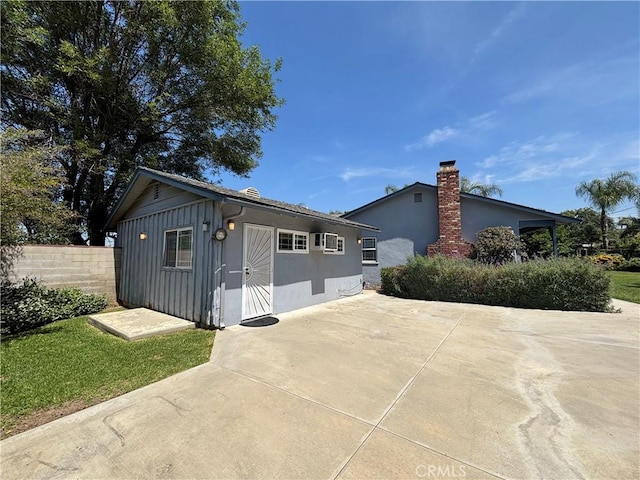 338 S La Serena Dr, West Covina, CA 91791 - view of front of property with board and batten siding, an outdoor structure, and a patio area