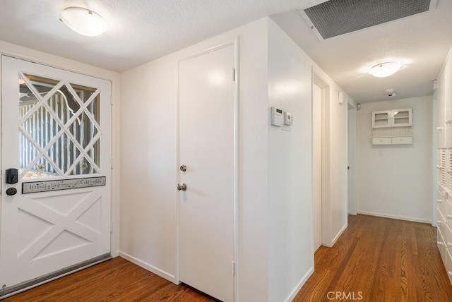 338 S La Serena Dr, West Covina, CA 91791 - entryway with wood finished floors, baseboards, and a textured ceiling