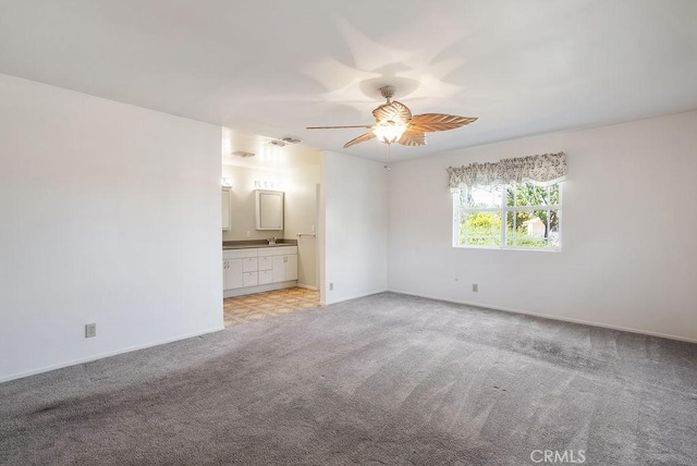 338 S La Serena Dr, West Covina, CA 91791 - empty room featuring light colored carpet, a ceiling fan, and baseboards
