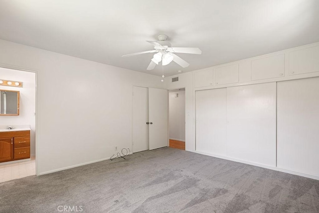 338 S La Serena Dr, West Covina, CA 91791 - unfurnished bedroom featuring light carpet, ensuite bath, a sink, and ceiling fan