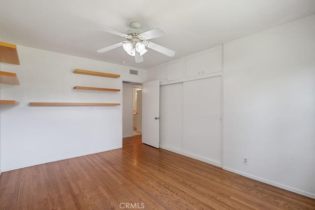 338 S La Serena Dr, West Covina, CA 91791 - unfurnished bedroom with a closet, wood finished floors, baseboards, and a ceiling fan