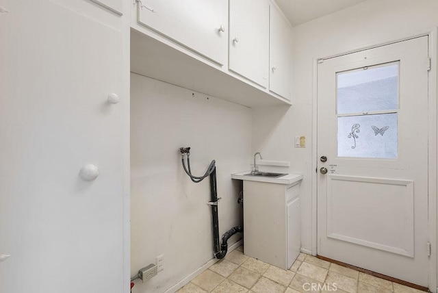 338 S La Serena Dr, West Covina, CA 91791 - laundry area featuring cabinet space, washer hookup, and baseboards