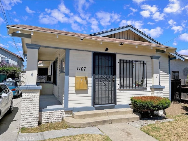 1107 Mahanna Ave, Long Beach, CA 90813 - view of front of property featuring covered porch and board and batten siding