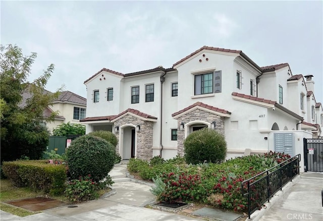 415 California St Unit D, Arcadia, CA 91006 - mediterranean / spanish home featuring stucco siding, a tile roof, and stone siding