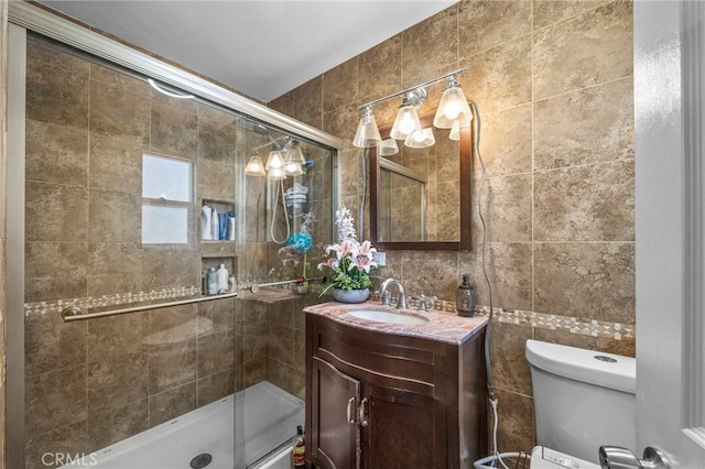 1709 S Townsend St, Santa Ana, CA 92704 - bathroom with tile walls, a shower stall, vanity, and toilet