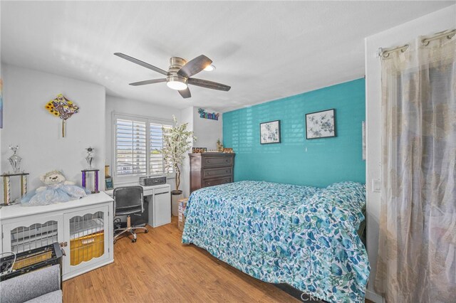 1709 S Townsend St, Santa Ana, CA 92704 - bedroom with wood finished floors, a desk, and a ceiling fan