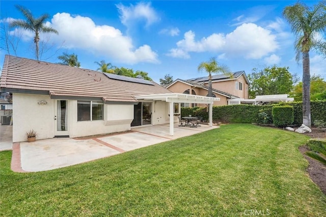 28613 Apricot Pl, Valencia, CA 91390 - back of house with roof mounted solar panels, stucco siding, a pergola, and a patio area