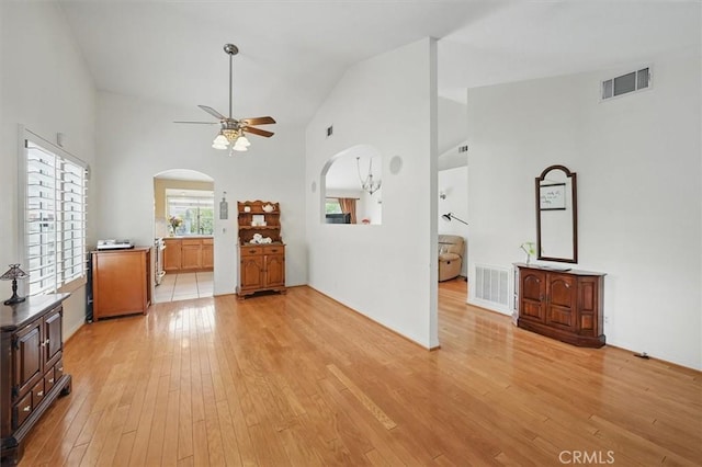 28613 Apricot Pl, Valencia, CA 91390 - unfurnished living room with a ceiling fan, arched walkways, light wood-style flooring, and high vaulted ceiling