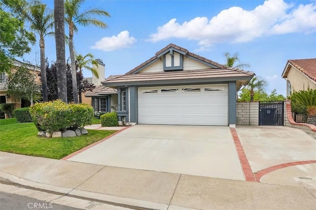 28613 Apricot Pl, Valencia, CA 91390 - ranch-style home with concrete driveway, a tiled roof, a gate, and a garage