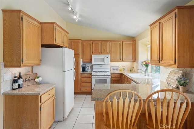 28613 Apricot Pl, Valencia, CA 91390 - kitchen featuring white appliances, a sink, a peninsula, backsplash, and lofted ceiling