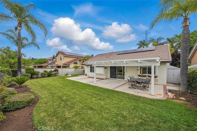 28613 Apricot Pl, Valencia, CA 91390 - rear view of house with stucco siding, roof mounted solar panels, a patio area, and a tile roof