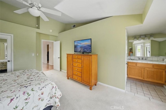 28613 Apricot Pl, Valencia, CA 91390 - bedroom with lofted ceiling, connected bathroom, light colored carpet, baseboards, and a sink