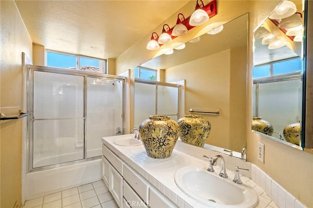 81 Via Barcaza, Coto De Caza, CA 92679 - full bathroom featuring double vanity, bath / shower combo with glass door, and tile patterned floors