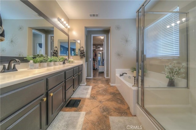 14663 Round Leaf Rd, Moreno Valley, CA 92555 - full bathroom with a bath, double vanity, and a shower stall