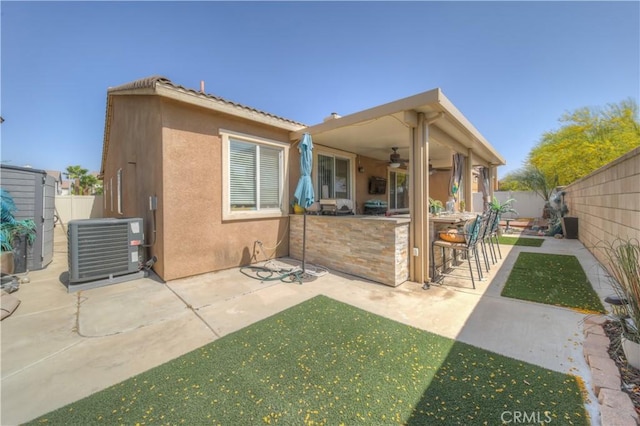 14663 Round Leaf Rd, Moreno Valley, CA 92555 - rear view of property with stucco siding, ceiling fan, a fenced backyard, a patio area, and cooling unit