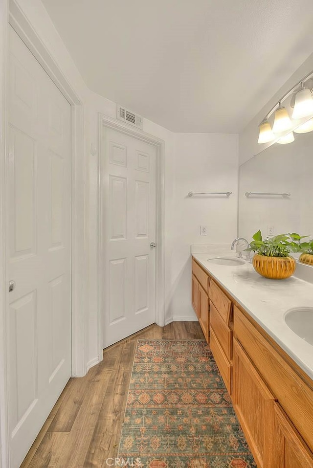 13023 Avenida Empresa, Riverside, CA 92503 - full bathroom with double vanity and wood finished floors