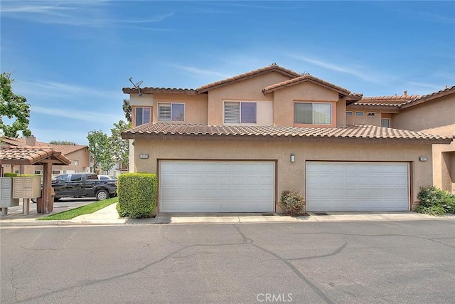 13023 Avenida Empresa, Riverside, CA 92503 - view of front facade with a garage and stucco siding