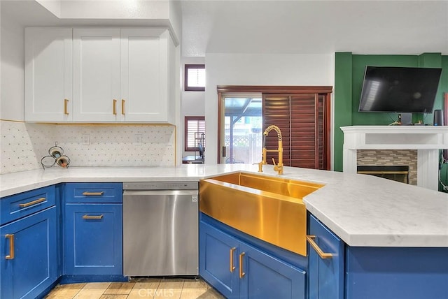 13023 Avenida Empresa, Riverside, CA 92503 - kitchen with dishwasher, blue cabinetry, white cabinetry, tasteful backsplash, and light countertops