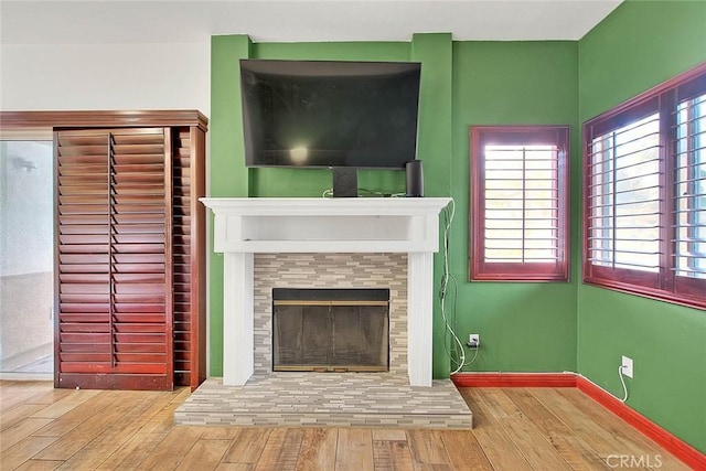 13023 Avenida Empresa, Riverside, CA 92503 - unfurnished living room with wood-type flooring and a tiled fireplace