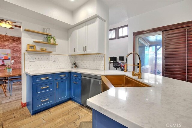 13023 Avenida Empresa, Riverside, CA 92503 - kitchen featuring dishwasher, blue cabinetry, light wood-type flooring, white cabinetry, and backsplash