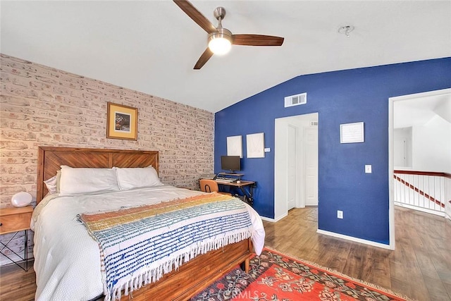 13023 Avenida Empresa, Riverside, CA 92503 - bedroom featuring vaulted ceiling, wood finished floors, an accent wall, and a ceiling fan