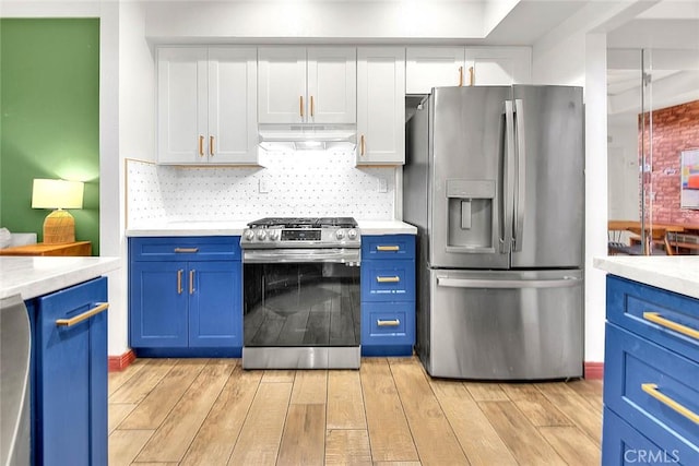 13023 Avenida Empresa, Riverside, CA 92503 - kitchen featuring appliances with stainless steel finishes, blue cabinets, under cabinet range hood, light wood-style floors, and light countertops