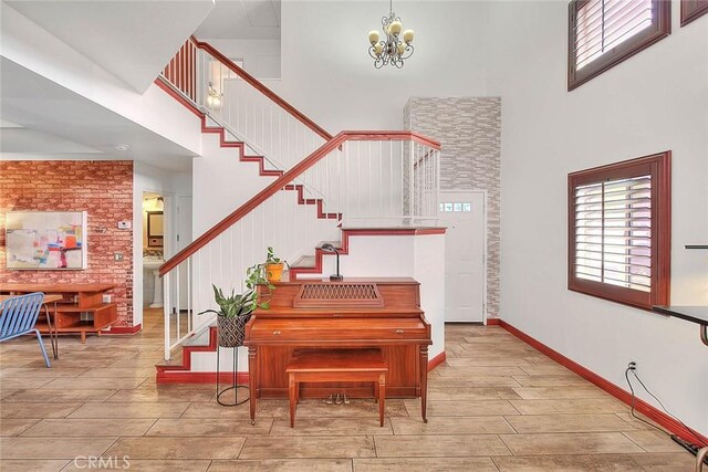 13023 Avenida Empresa, Riverside, CA 92503 - stairs with a high ceiling, a chandelier, and wood tiled floors