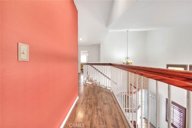 13023 Avenida Empresa, Riverside, CA 92503 - corridor with a chandelier, wood finished floors, an upstairs landing, and a textured wall
