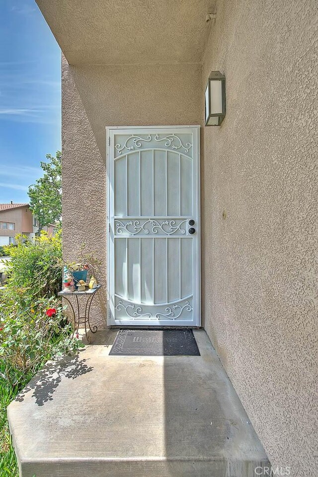 13023 Avenida Empresa, Riverside, CA 92503 - property entrance featuring stucco siding