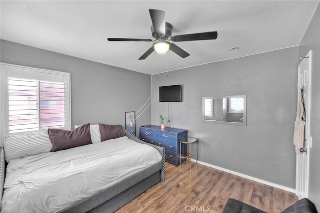 13023 Avenida Empresa, Riverside, CA 92503 - bedroom with multiple windows, wood finished floors, a textured ceiling, and ceiling fan