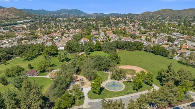 view of property location featuring a mountain backdrop and nearby suburban area