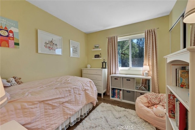bedroom featuring wood finished floors