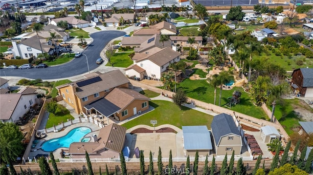 view of property location featuring nearby suburban area and a pool
