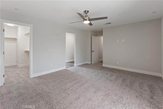 6018 William St, Riverside, CA 92504 - unfurnished bedroom with carpet, baseboards, ceiling fan, and a spacious closet
