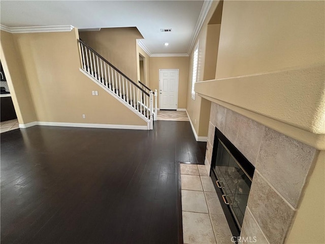 15986 Wilmington Rd, Chino Hills, CA 91709 - entrance foyer featuring stairway, light wood-style floors, baseboards, ornamental molding, and a tile fireplace