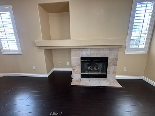 15986 Wilmington Rd, Chino Hills, CA 91709 - detailed view of baseboards, wood finished floors, and a tile fireplace