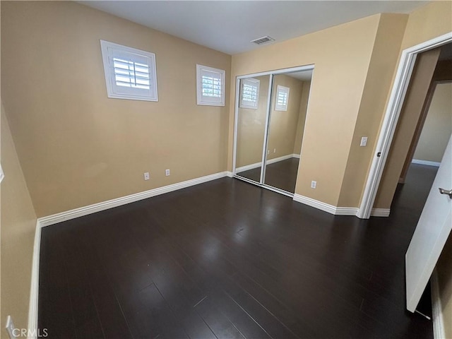 15986 Wilmington Rd, Chino Hills, CA 91709 - unfurnished bedroom with dark wood-style floors, baseboards, and a closet