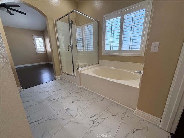 15986 Wilmington Rd, Chino Hills, CA 91709 - full bath featuring marble look tile flooring, a garden tub, a shower stall, and baseboards