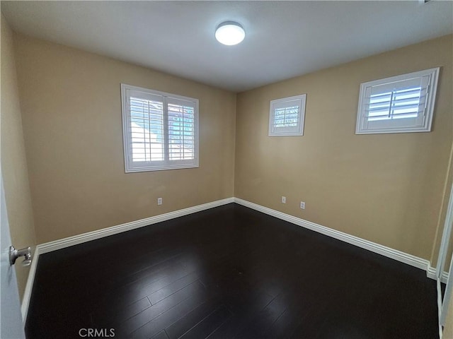 15986 Wilmington Rd, Chino Hills, CA 91709 - spare room with healthy amount of natural light, baseboards, and dark wood-style floors
