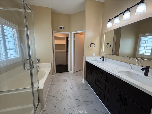 15986 Wilmington Rd, Chino Hills, CA 91709 - full bath featuring marble look tiles, a shower stall, a bath, a walk in closet, and double vanity