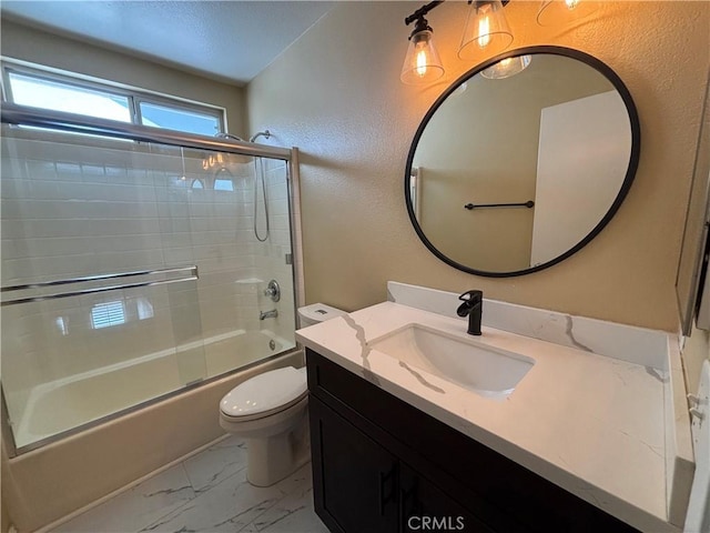 15986 Wilmington Rd, Chino Hills, CA 91709 - full bathroom with toilet, marble look tile flooring, vanity, enclosed tub / shower combo, and a textured wall